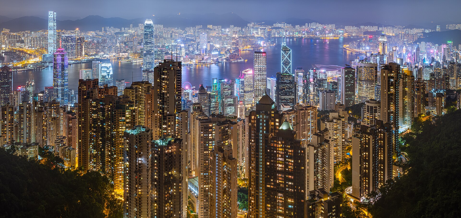 Hong Kong's skyline and Victoria Harbour glowing at night